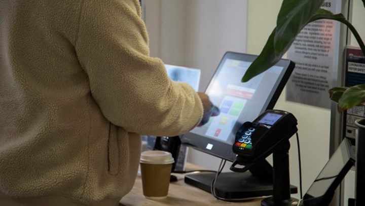 student using self scan and payment options on campus