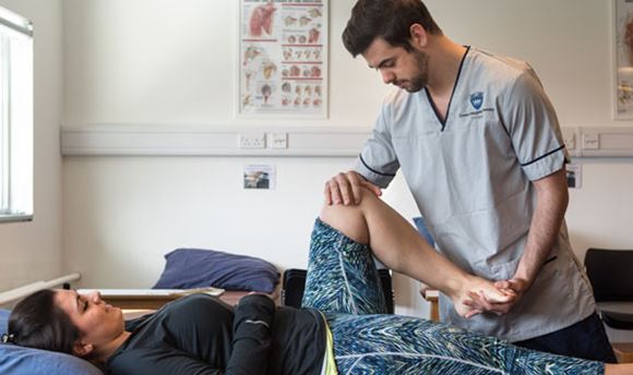 Queen Margaret physiotherapy student treating a patient
