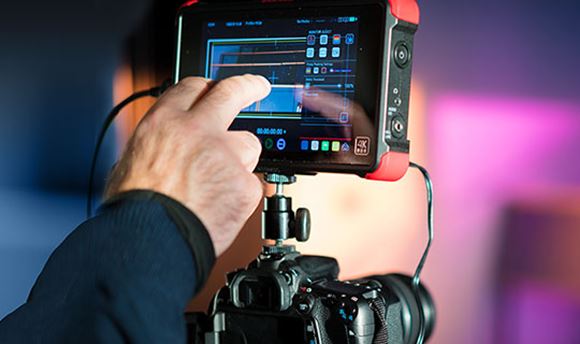 Close up of a high end digital camera with a touch screen for editing