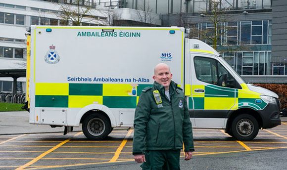 Photo of paramedic with ambulance